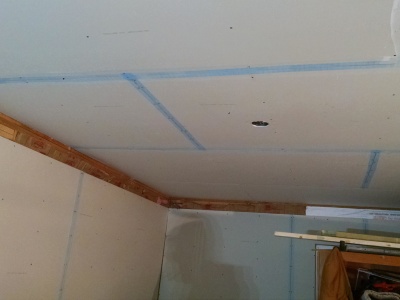 Installing drywall in garage with finishing